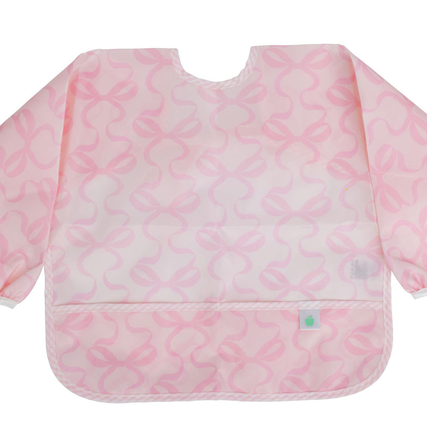The Cover Everything Bib in Bows on Pink