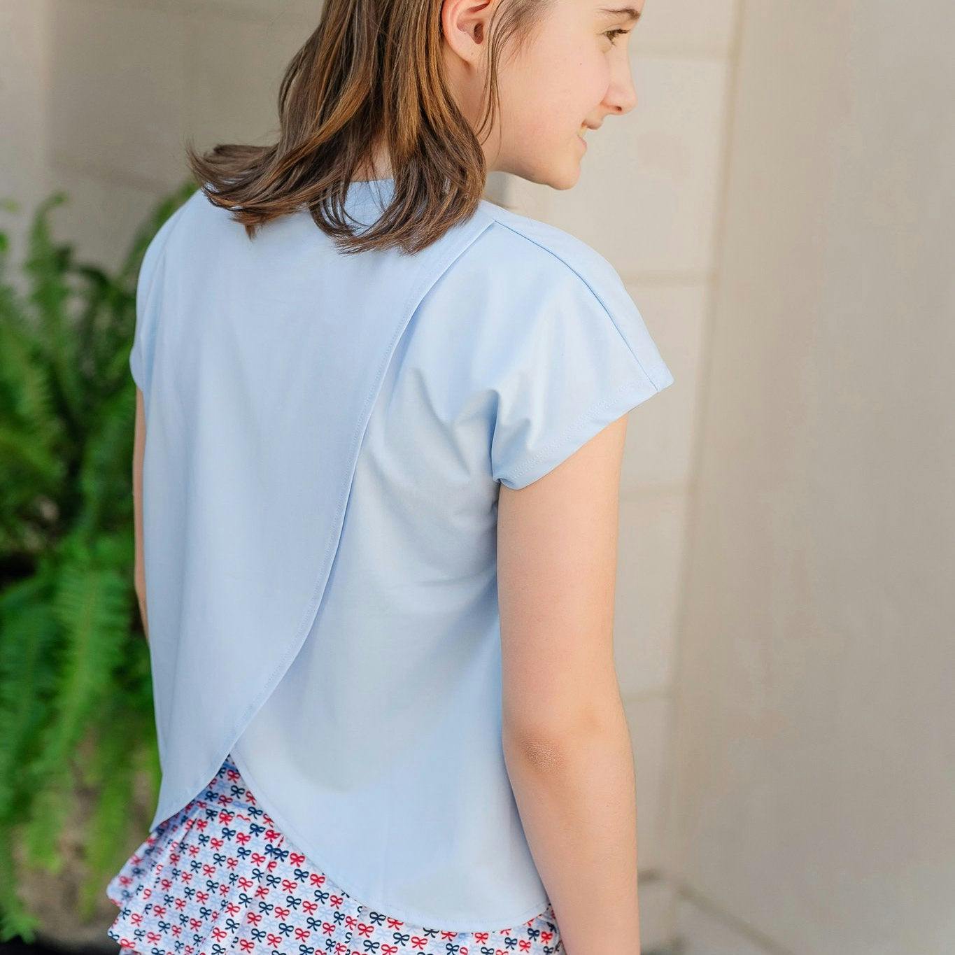Sloane Girls' Short Sleeve Performance Top by LH Sport - Light Blue