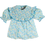 Leontyne Floral Scalloped Smocked Detail Short Sleeve Blouse in Blue Made with Liberty Fabric (2- 10yrs)