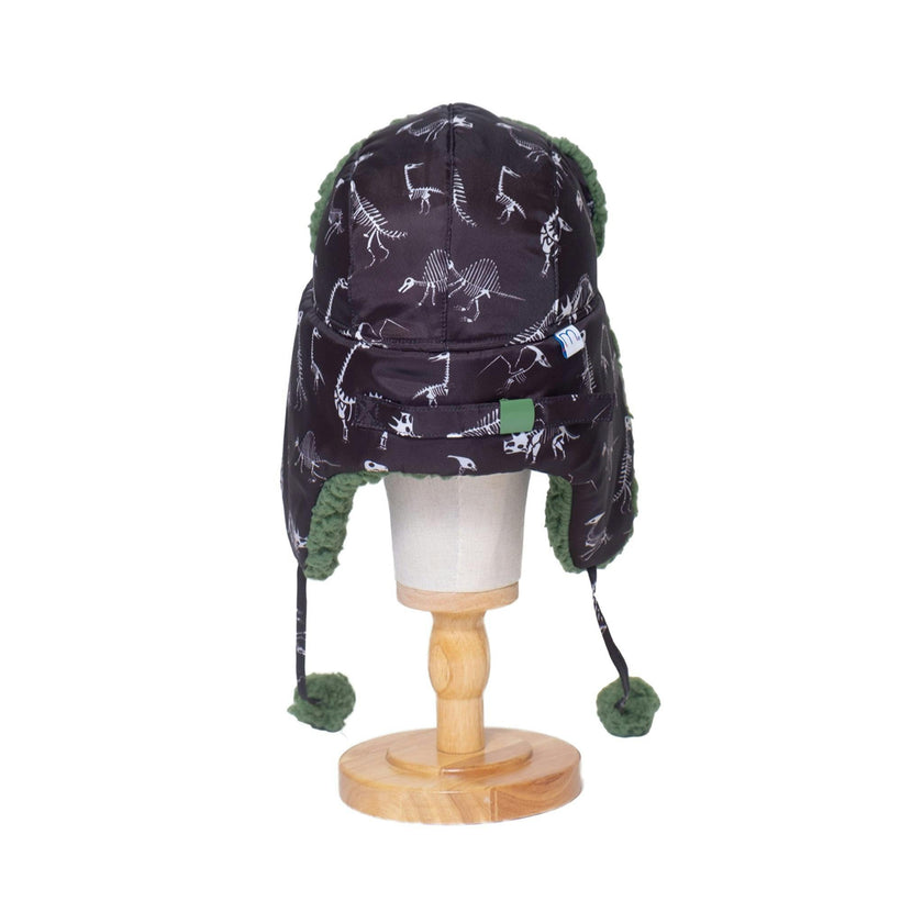 The Cozy Trapper – Dino Bones Print with Katydid Green Sherpa Liner & Pompoms