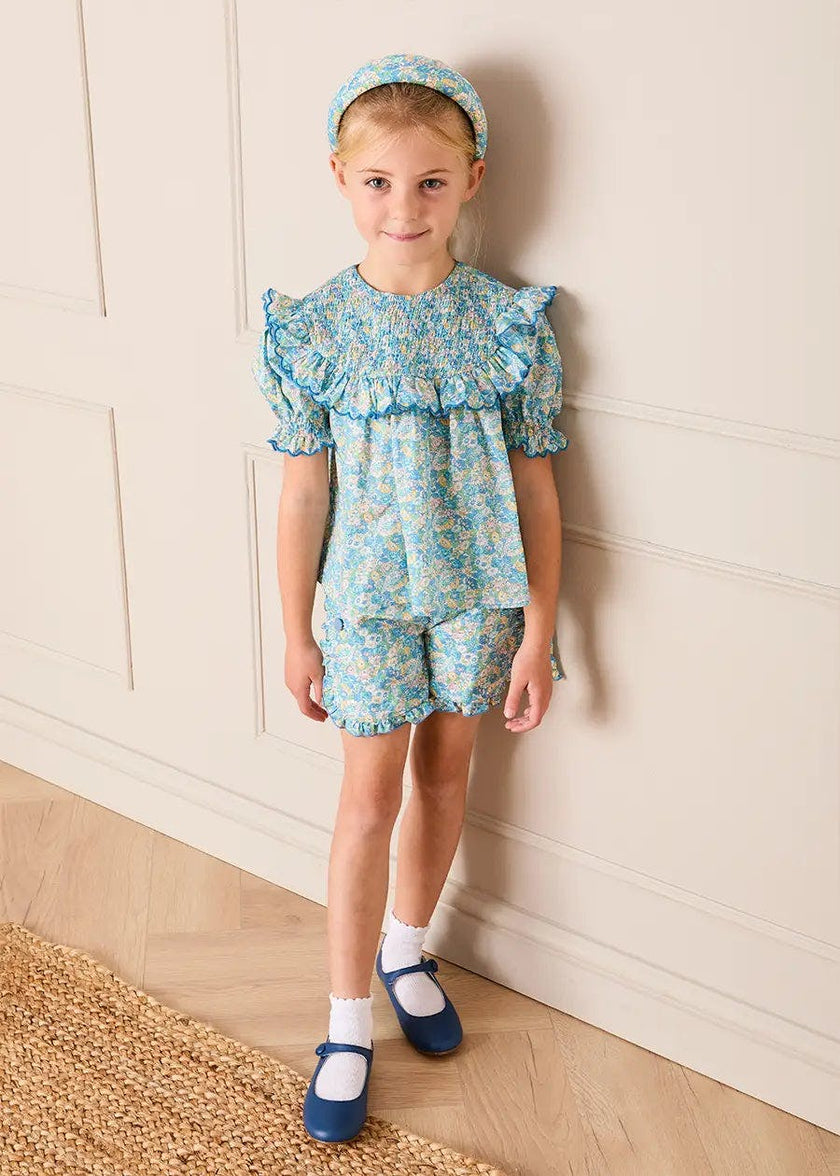 Leontyne Floral Scalloped Smocked Detail Short Sleeve Blouse in Blue Made with Liberty Fabric (2- 10yrs)
