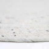 Neethu Hand-Crafted Felted Wool Round Rug, Natural