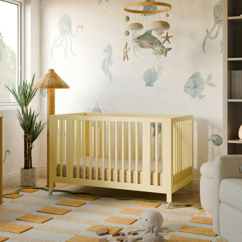Rolli 9-in-1 Convertible All-Stages® Crib with Bassinet & Toddler Bed Conversion Kits in Pale Yellow