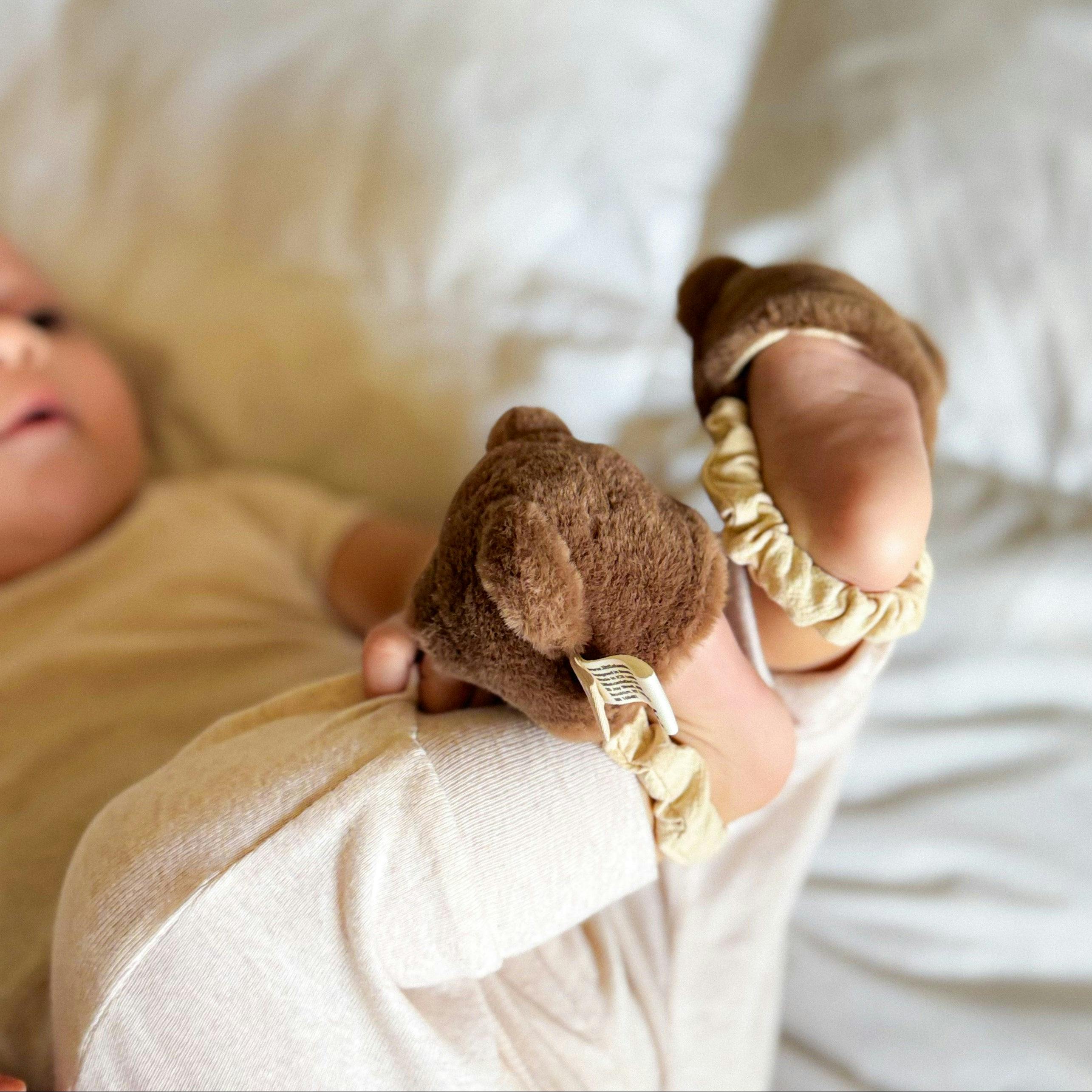 Teddy kicking rattle