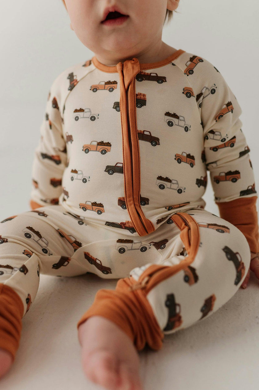 Baby Boy Long Sleeve Zip Romper in Pumpkin Trucks