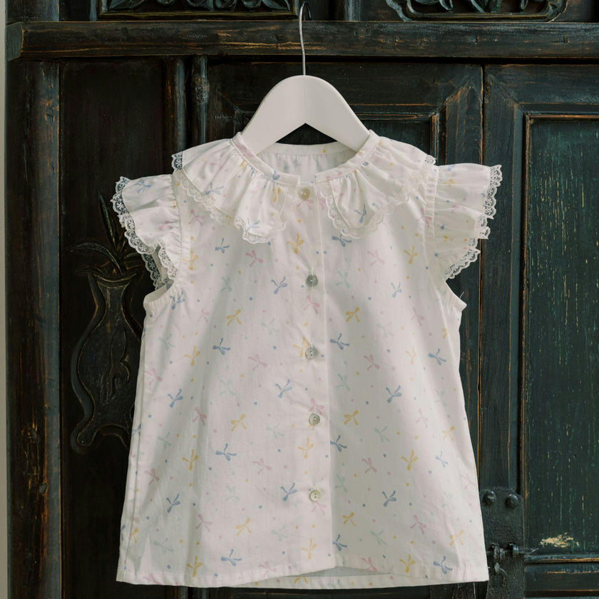 Nicky Hilton x La Coqueta Ivory Bow Olivia Girl Shirt