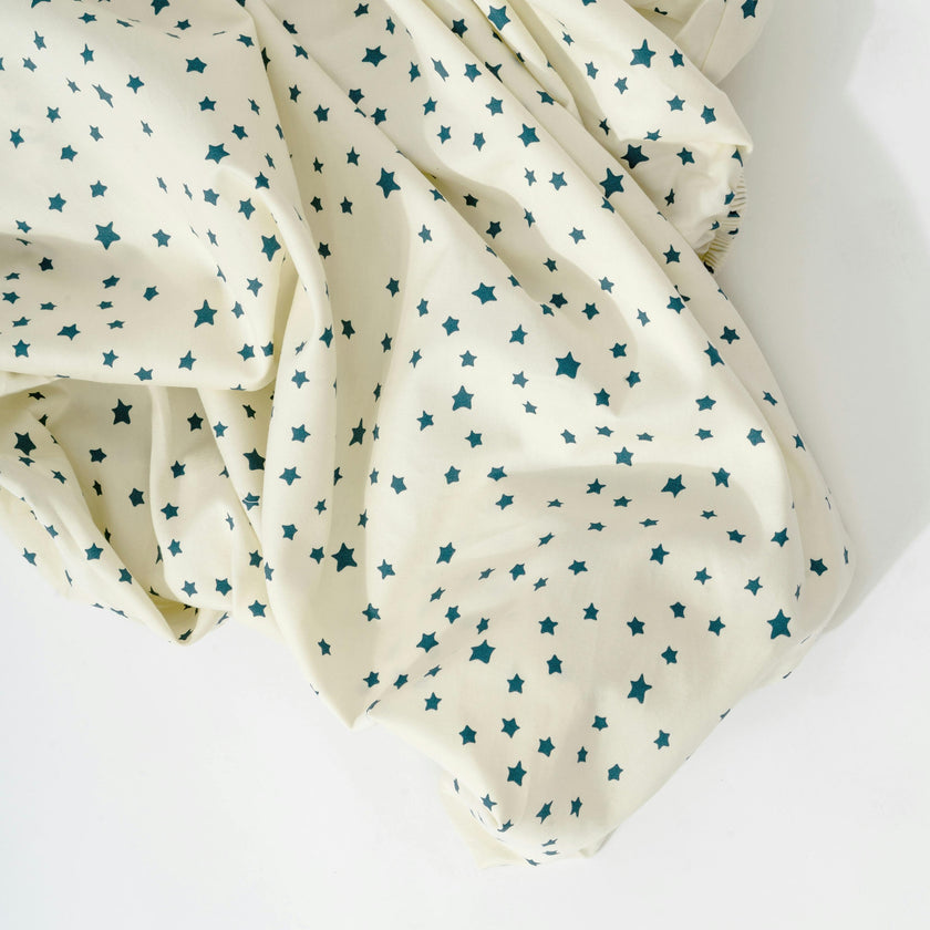 Crib Sheet in GOTS Certified Organic Brushed Cotton in Ivory with Navy Stars