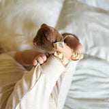 Teddy kicking rattle