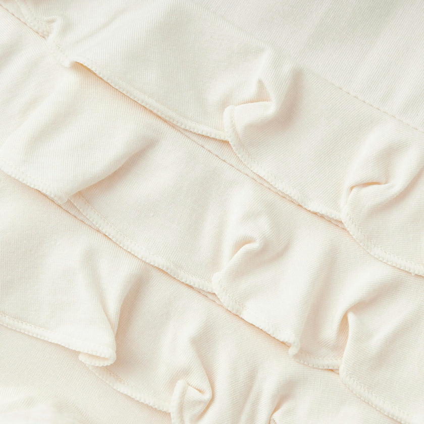 Salt Luxe Solid Ruffle Footed Romper