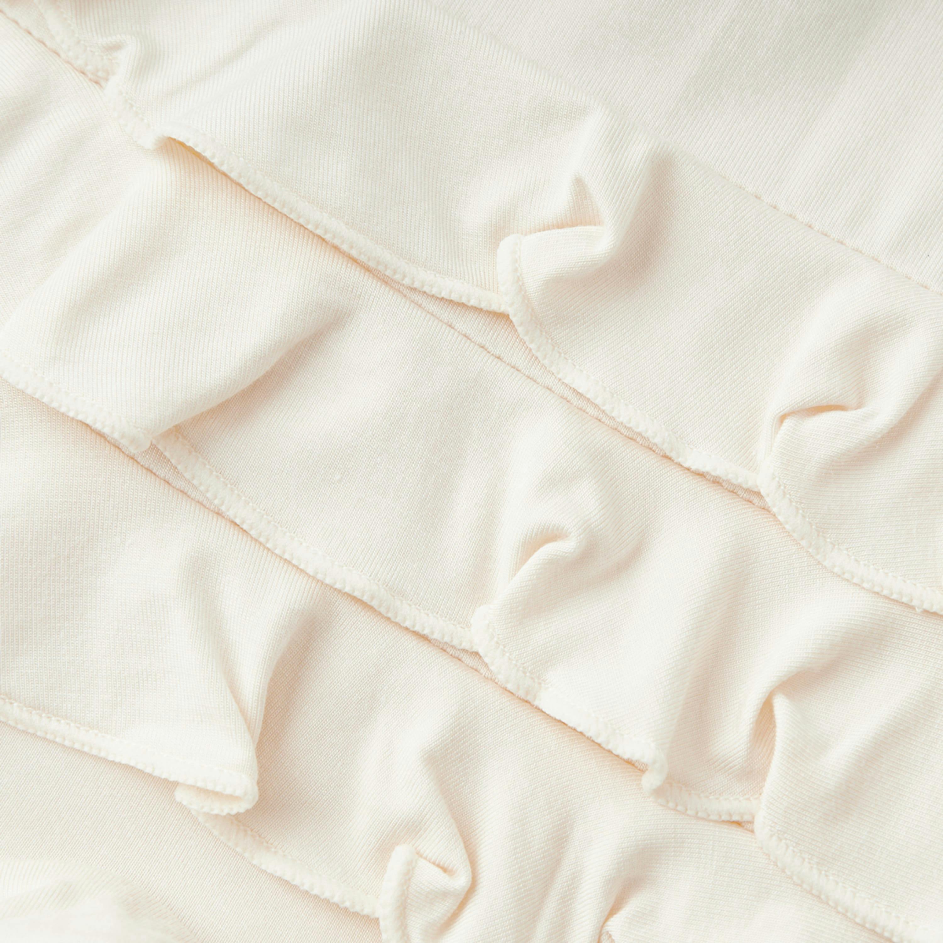 Salt Luxe Solid Ruffle Footed Romper