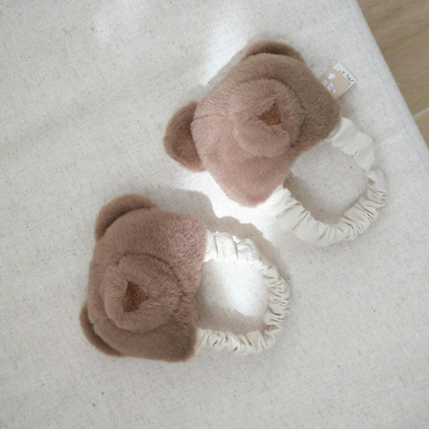 Teddy kicking rattle