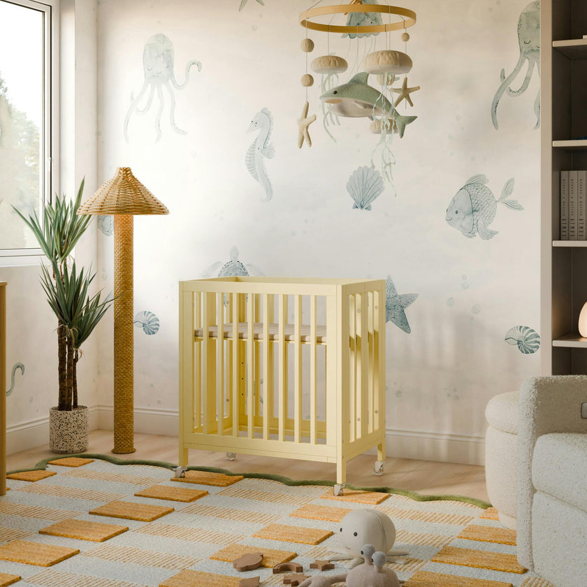 Rolli 9-in-1 Convertible All-Stages® Crib with Bassinet & Toddler Bed Conversion Kits in Pale Yellow