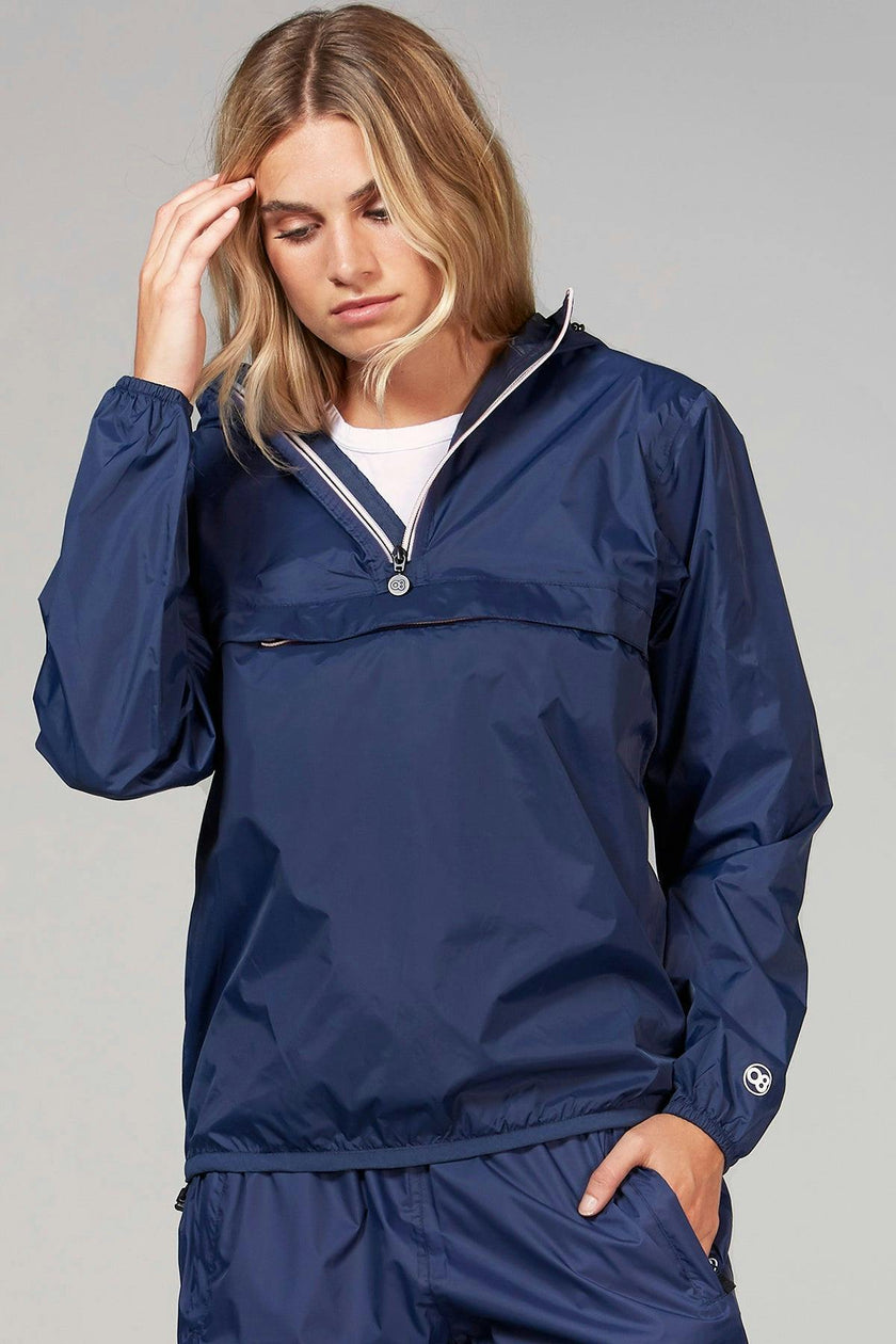 Navy women's quarter zip packable rain jacket and windbreaker