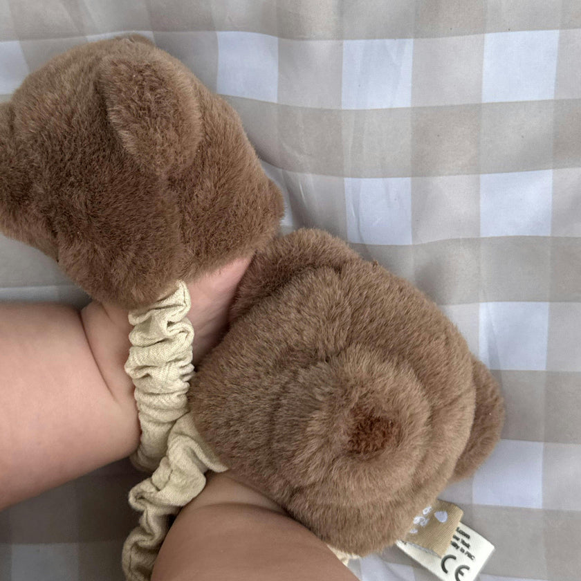Teddy kicking rattle